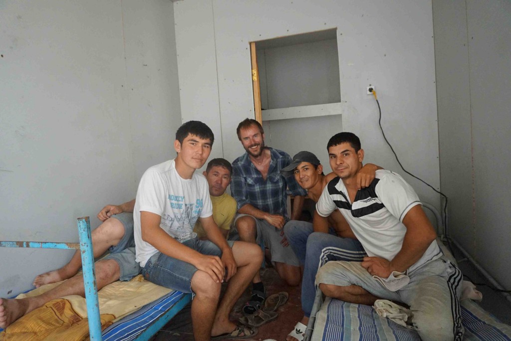 Hiding from the heat and wind with railway workers in their air conditioned container unit.