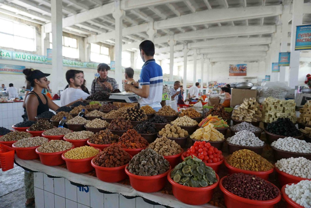 Bekh haggling for nuts on our behalf in Bukhara