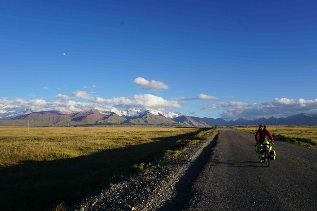 Looking back towards the Pamir mountains on the approach to Sary Tash with Sonia from Germany