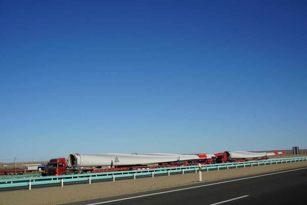 Wind turbine blades were often seen on the move in Xinjiang, which has windfarms the size of a small English county.