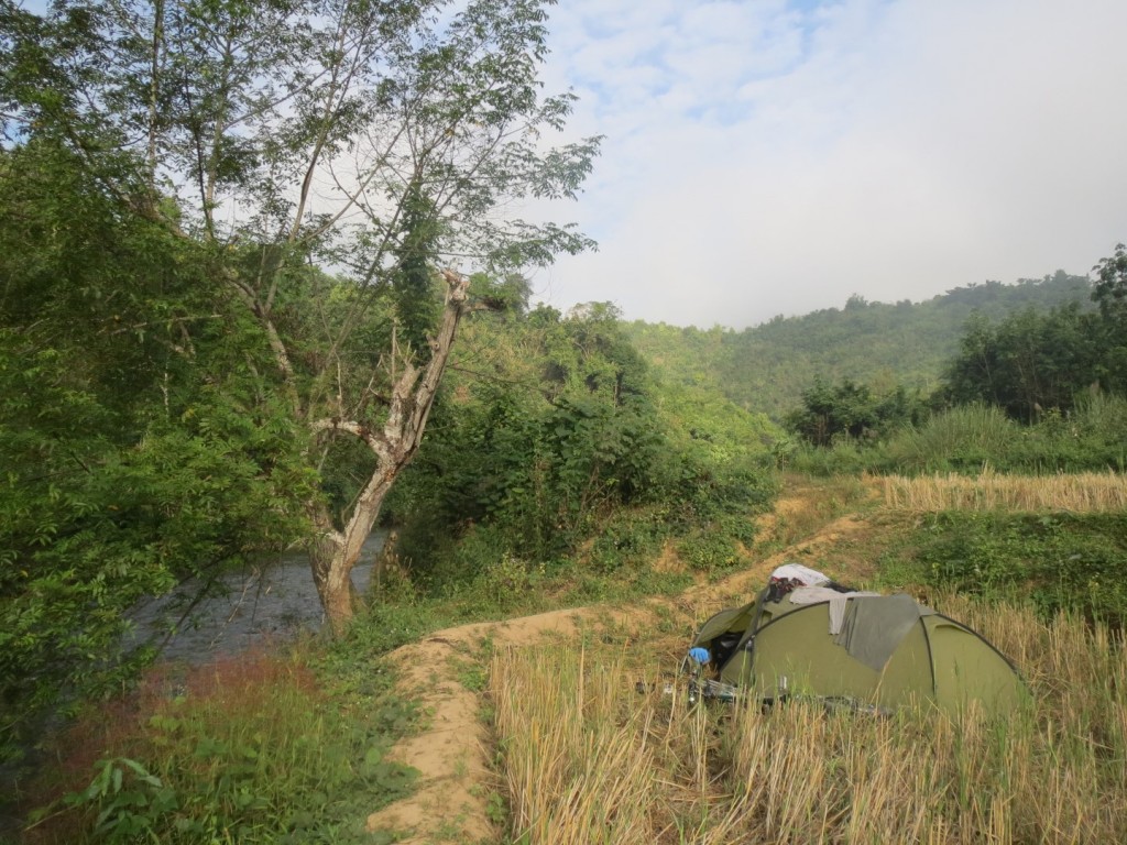 Riverside camping in Laos, great to have a bath after such a sweaty, dusty day on the road.