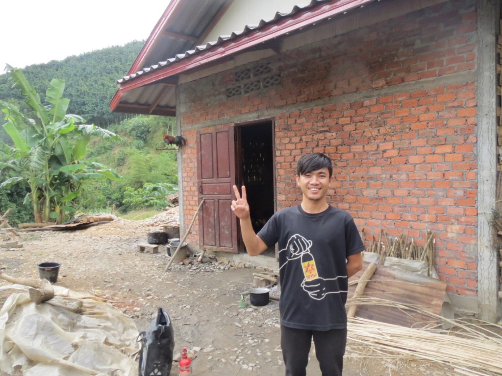 With John Chang, who kindly took me in for the night after I left LP. Note the rooster on the wall - there were another four of them inside the house (a barn really), which went off at 20 minute intervals throughout the night. I hate roosters.